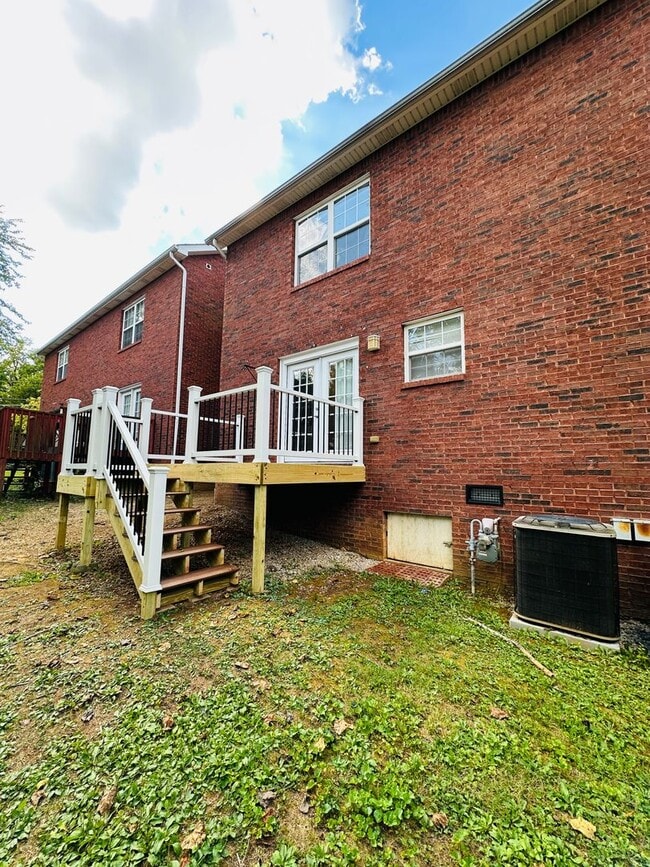 Building Photo - 2 bed, 2.5 bath updated townhouse w/ 1-car garage & Trex deck available now