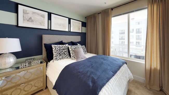 Well appointed bedroom with oversized windows - The Adeline