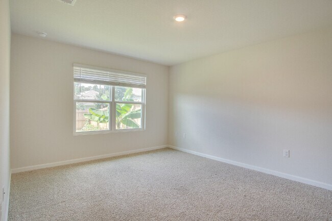 Building Photo - 4-Bed, 2-Bath Home in Woodlands Subdivision with Solar, Open-Concept Living, Modern Kitchen, Fenc...