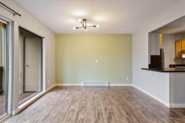 Building Photo - $500 off! Spacious 1-bdrm/1-bath condo in quiet neighborhood. Balcony, 2 parking spaces, fireplac...