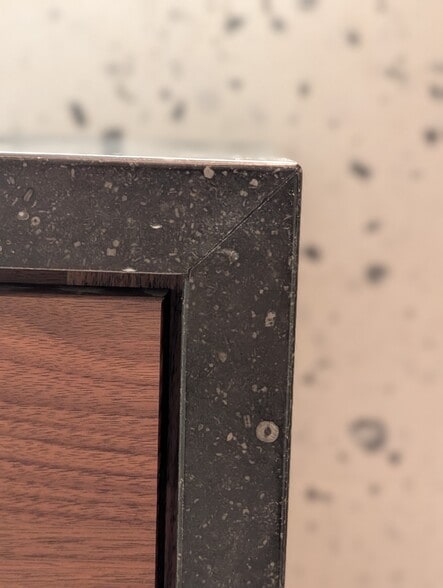 Main bath counters are petit granit, a stone mined in Belgium that features embedded fossil imprints - 328 Lexington St