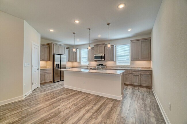 Building Photo - Available 08-05-25! Coastal Luxury Townhom...