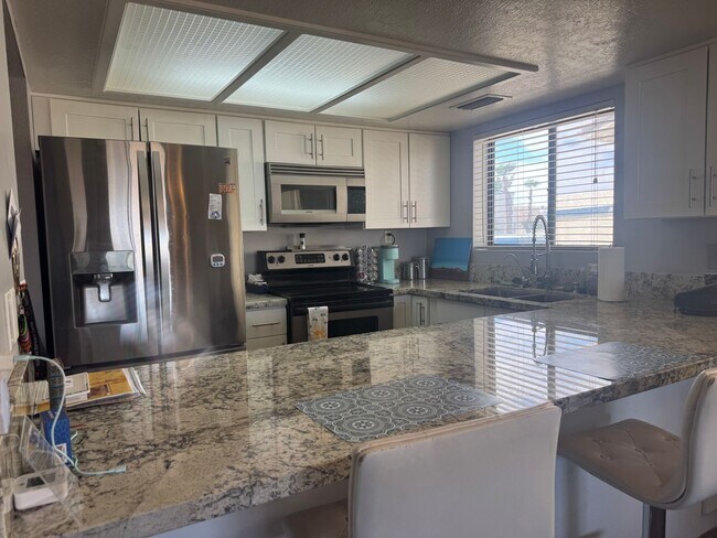 Building Photo - FURNISHED 2BR CONDO w/Utilities Water View Gated NO STAIRS