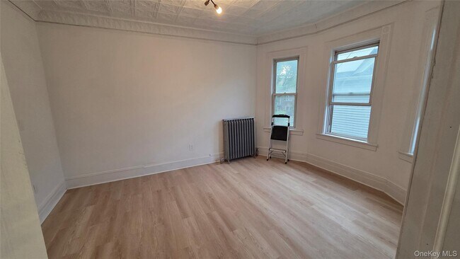 Building Photo - 42-21 65th Pl