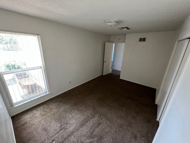 Building Photo - 4 bedroom 2 bath,  fenced yard w/ fruit tr...