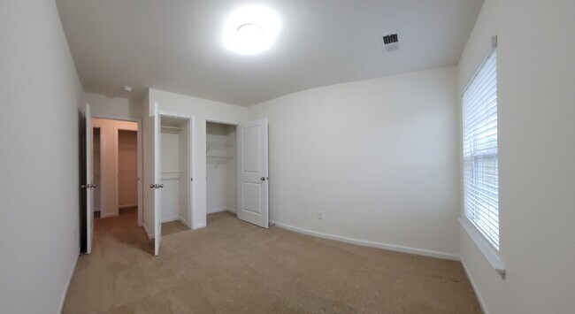 Building Photo - "Modern 3-Bedroom Multiplex with 3 Full Ba...