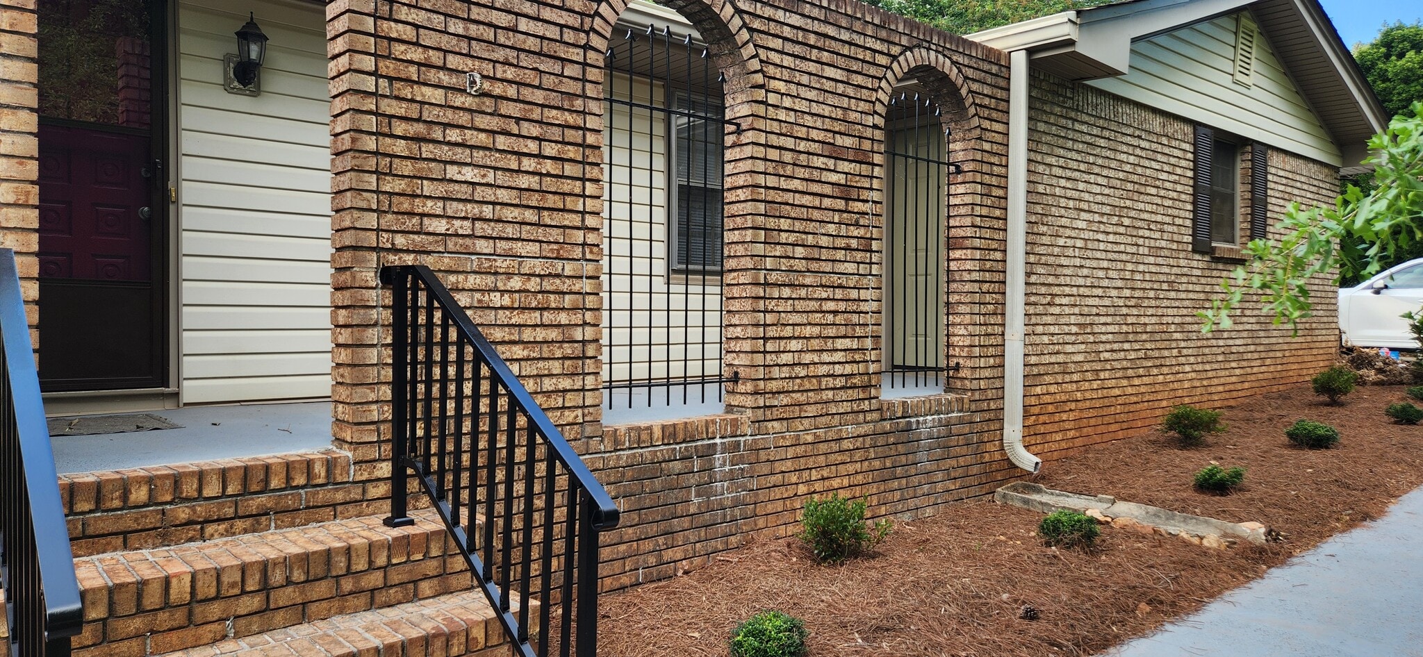 Secluded front porch hidden from street view by trees - 5787 Lorraine Dr