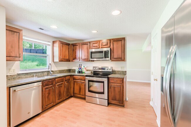 Building Photo - Spacious 3 bedroom home in desirable SW Durham! Super dog friendly with large fenced yard!