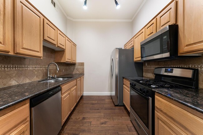 Building Photo - Upgraded condo in gated community
