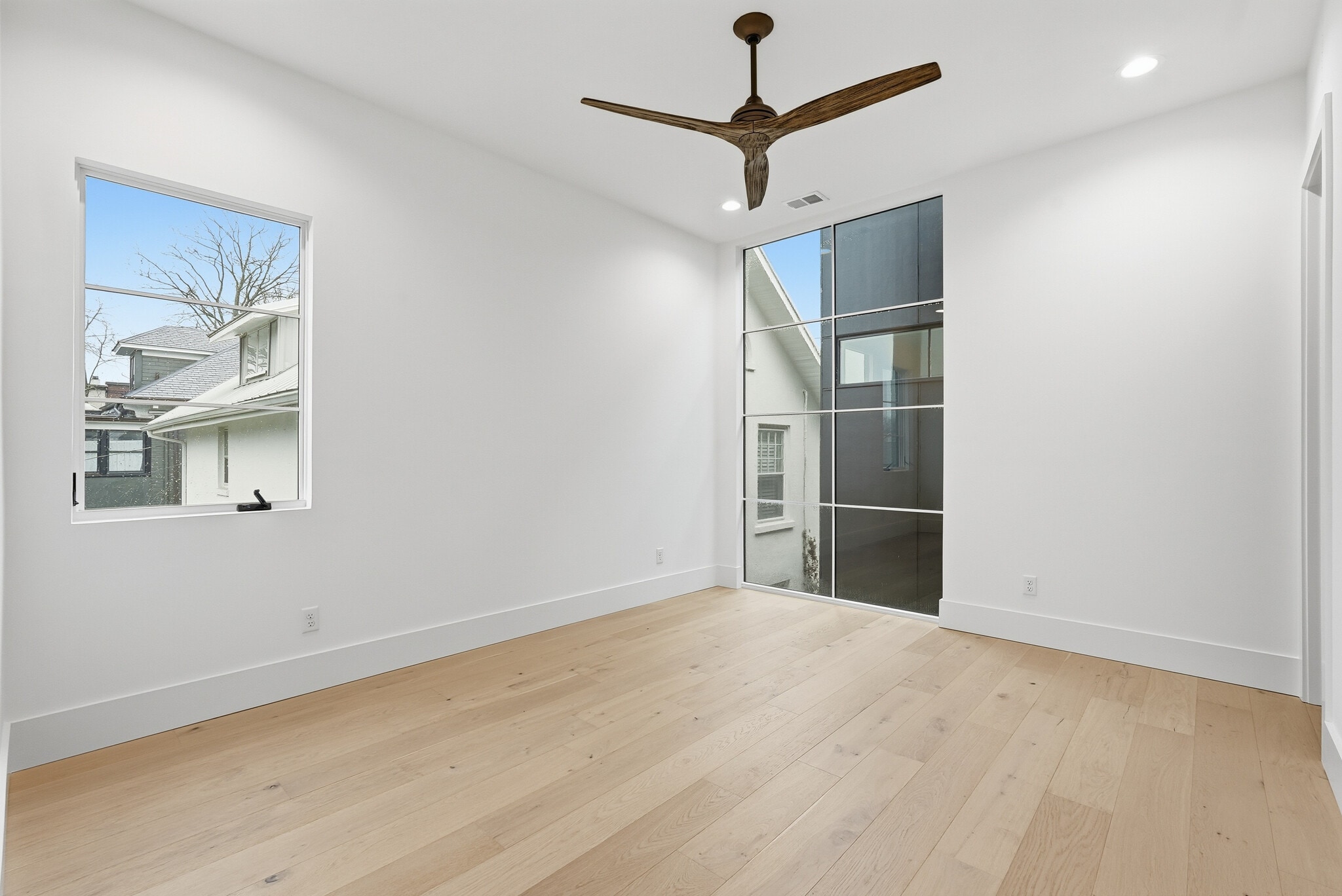 Spacious bedroom featuring modern flooring, neautral tones, and abundant natural light - 3718 West End Ave