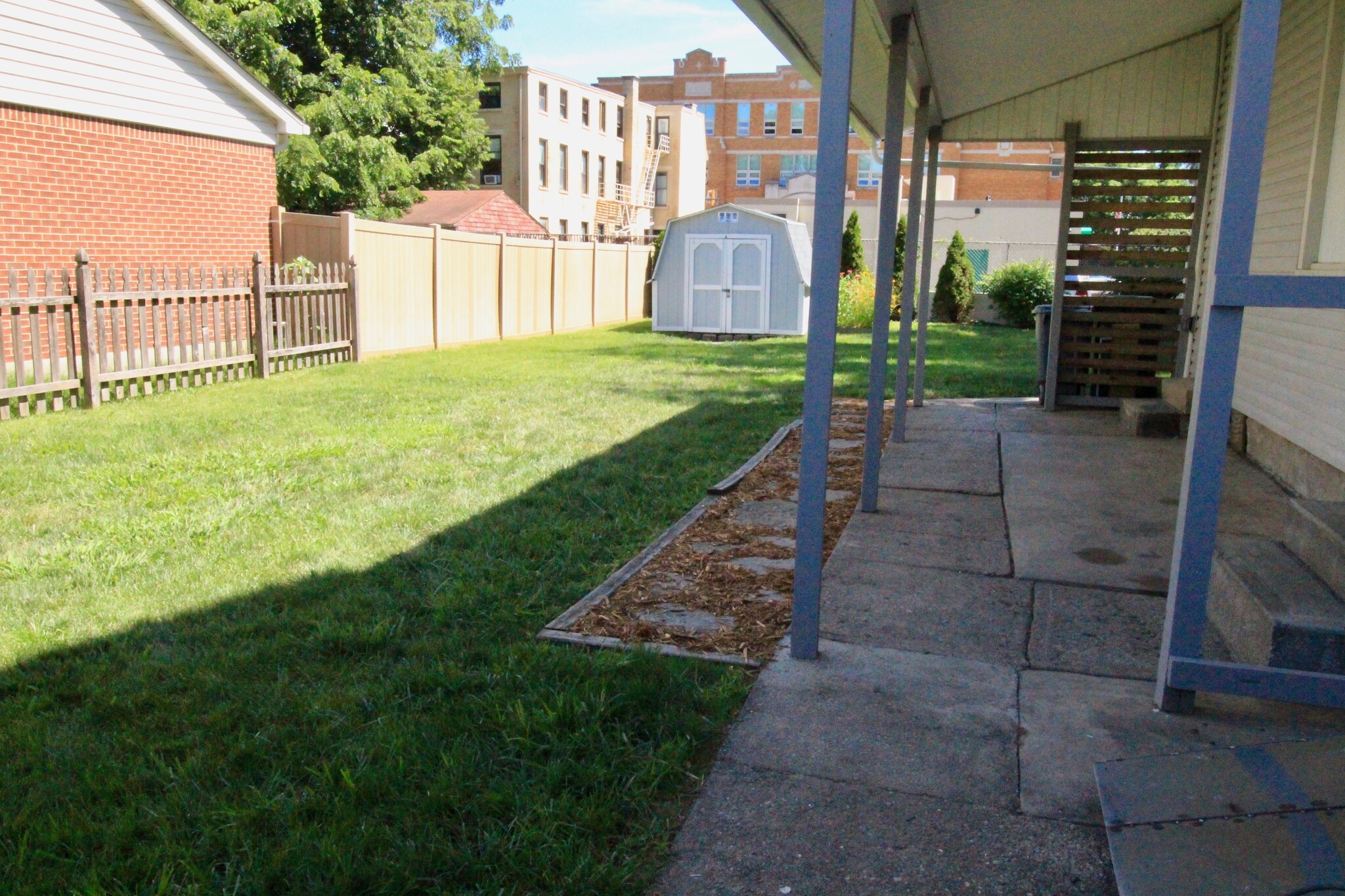 Fully fenced, level yard with spacious shed - 4536 Leo Street