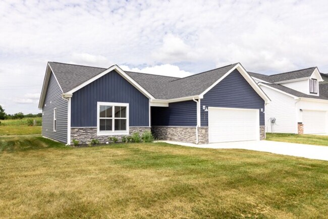 Building Photo - Modern Living Redefined with Stone Fireplace, Gray Cabinetry, Spa Inspired Primary Suite and Cove...