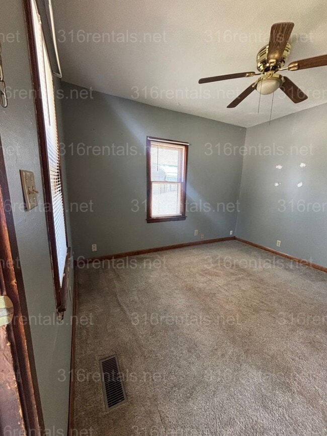 Building Photo - Two bed one bath fenced in yard house available now