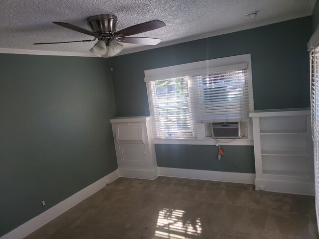 Front room with bookshelf - 1666 Locust St