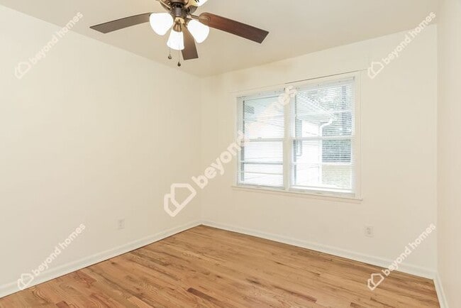 Building Photo - This Cozy 4 bedroom / 2 full bath and 2,09...