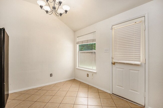 Building Photo - Welcome to this charming 4-bedroom, 2-bath...