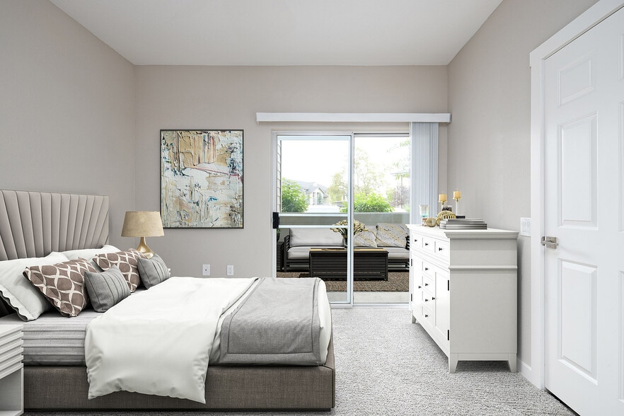 Experience serene living in this elegantly designed bedroom with access to a private patio. - Timberline Place