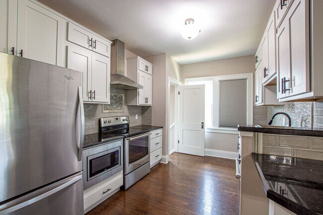 Building Photo - Adorable Brick 4 Bedroom Ranch with Finish...