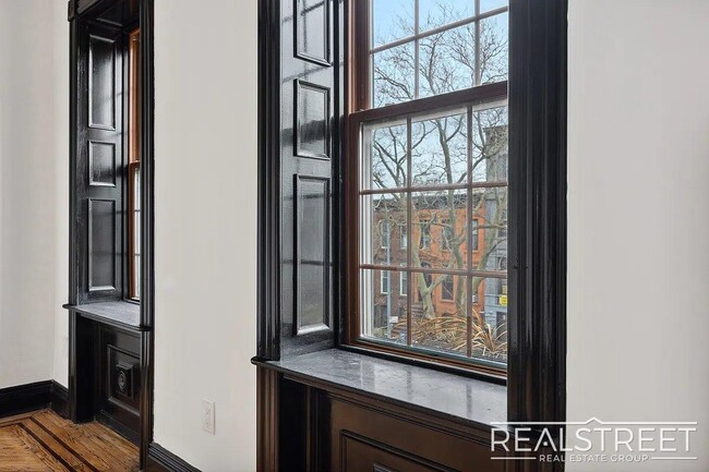 Building Photo - Timelessly Renovated Historic Triplex with...