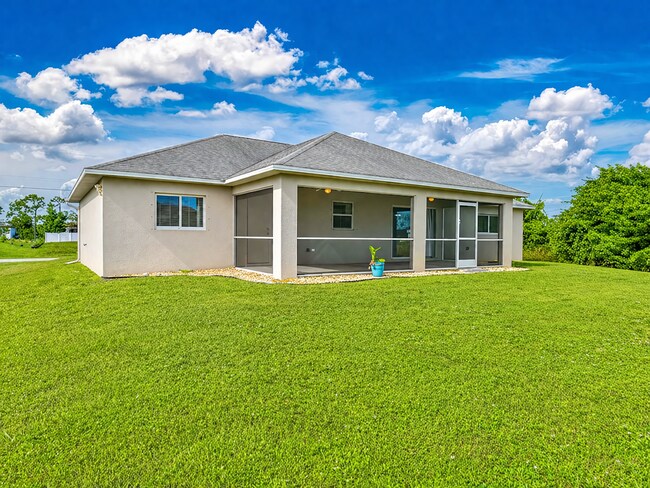 Building Photo - Spacious Three-Bedroom Home with Open Floor Plan, Large Yard & Screened Patio