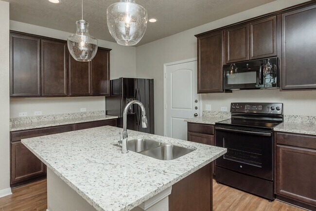 Building Photo - Live, love, and grow in this charming townhome!