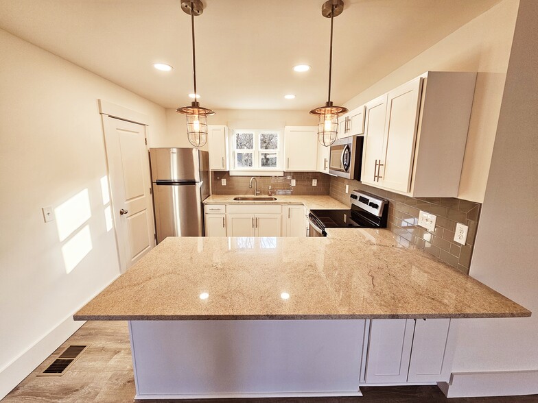 Walk in kitchen with plenty of storage and great natural light. - 1219 N 7th St
