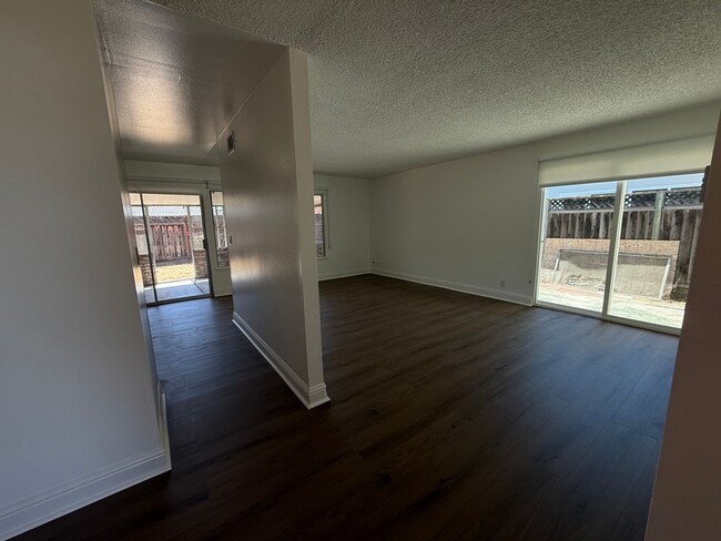 Building Photo - Recently updated home with new floors, paint & bathroom!
