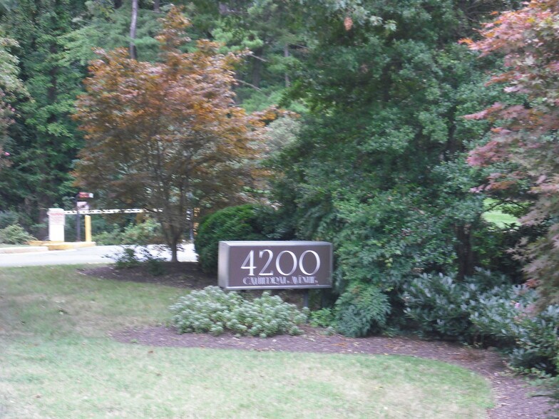 Surrounded by trees. - 4200 Cathedral Ave NW