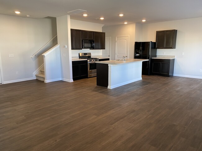 Kitchen open to living area - 9010 Fenton Rd.