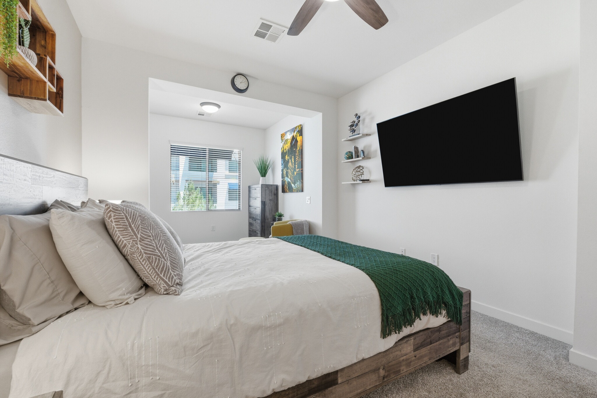 Spacious primary suite with plush bedding and thoughtful touches. - 2511 W Queen Creek Rd
