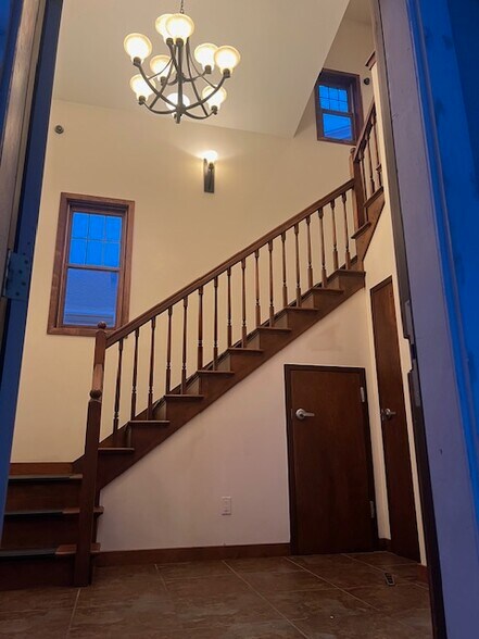 Staircase to upper - back lobby - 1701 W National Ave
