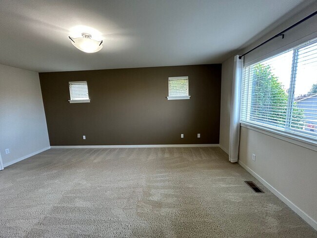 Building Photo - 4 bed/2.5 bath and 3 car garage and a down...