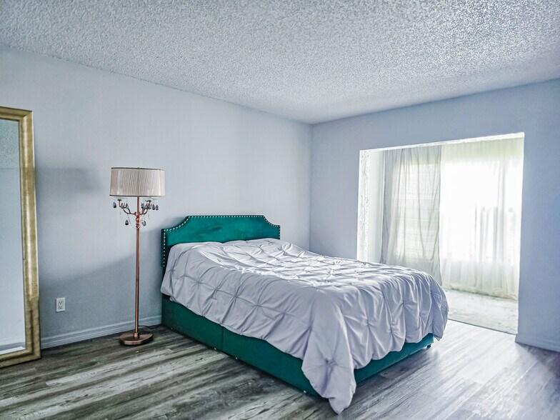 Master bedroom with a separate space for an office or workout area - 1986 Pelican Landing Blvd