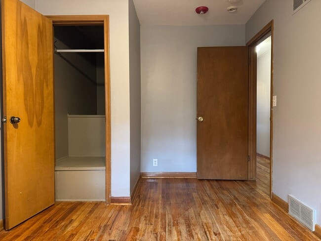 Building Photo - Bright & Spacious 3-Bedroom Duplex Unit on Large Corner Lot with Wood Floors & Garage!