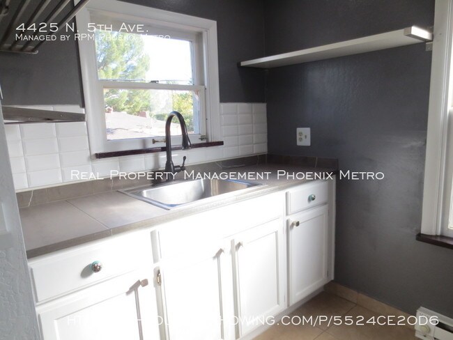Building Photo - UPTOWN HOME WITH PRIVATE YARD!