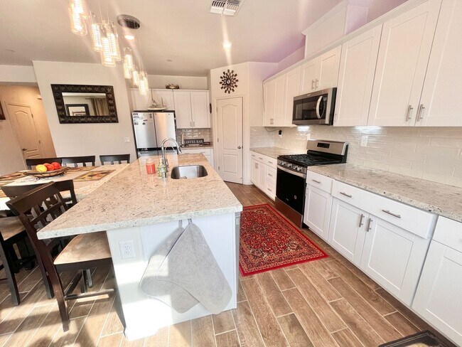 Building Photo - Reduced!! Stunning 5-bedroom, 3-bathroom residence with Solar!