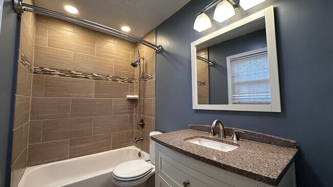 Building Photo - Spacious 4-Bedroom, 3-Bath Home with Moder...