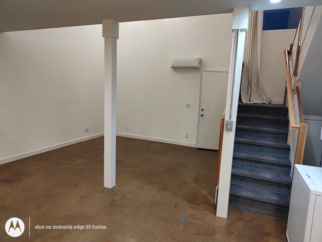 LIVINGROOM WITH STAIRWELL - 213 N Avenue 63