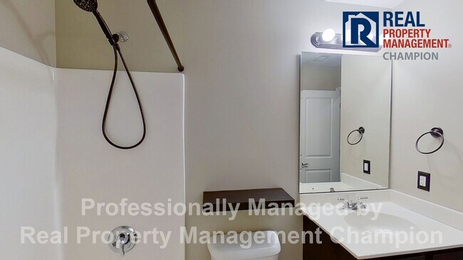 Building Photo - Beautiful home boasts open floorplan, screened porch, and spacious fenced yard