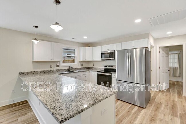 Building Photo - 6961 Raymond Ave