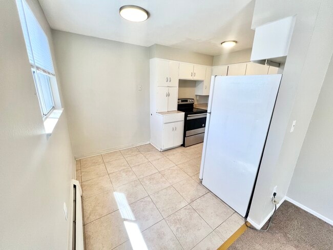 Explore this inviting kitchen, perfect for culinary creations and everyday meals. - Westland Apartments