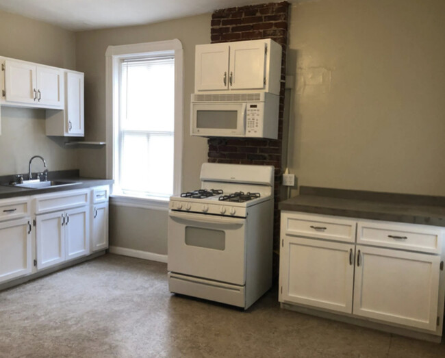 Large eat in kitchen. Previous resident fit a table with 6 chairs. Paint is updated to white. - 5313 Magnolia Ave