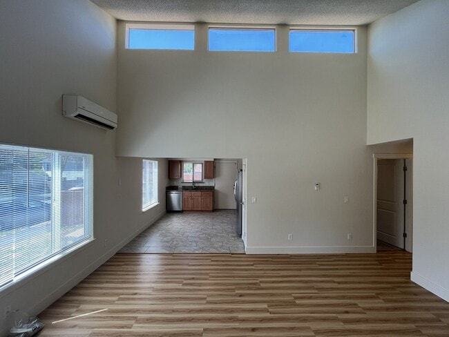 Building Photo - Bright and Airy Home with Stainless Steel Kitchen, Vaulted Ceilings & Washer + Dryer