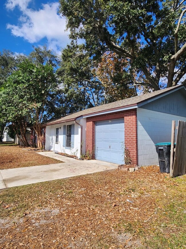 Building Photo - Cozy and Roomy! Nice corner lot home 2 Bedrooms 2 Baths with 1 car garage and huge backyard. Pets...