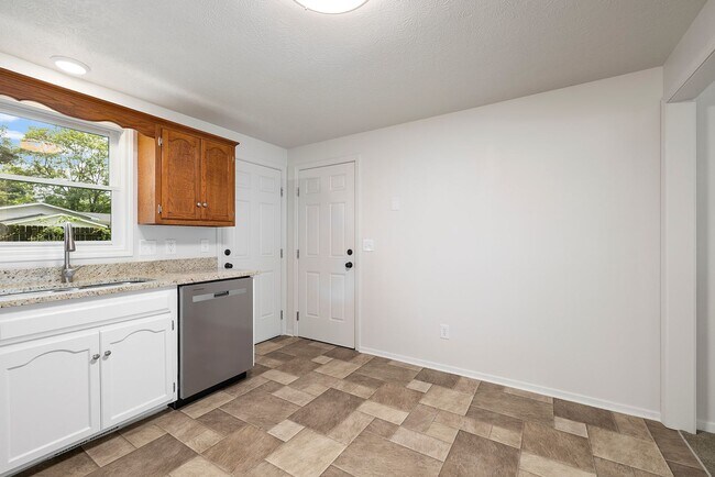 Building Photo - Charming Updated Home with 1-Car Garage, Fenced Backyard & Modern Finishes