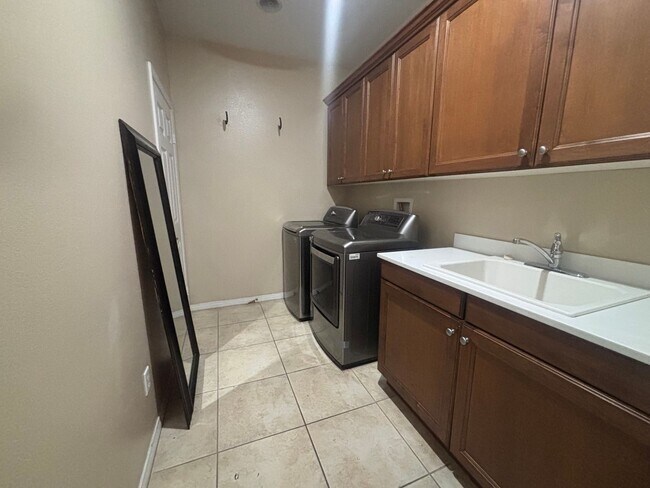 Building Photo - Short Term Lease - Grand 4-Bedroom Home with Entertainer's Yard in Gated River Village!