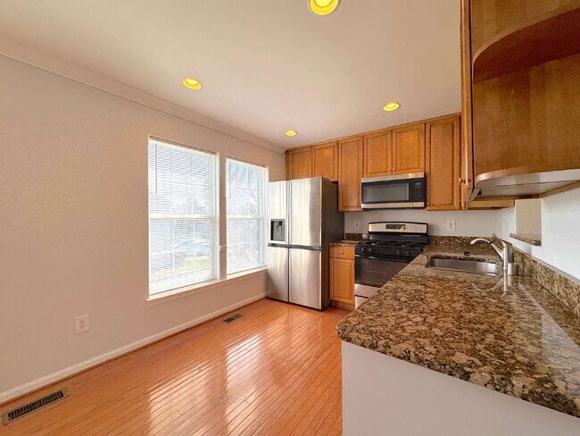 Building Photo - Inviting Suburban Retreat with Spacious Layout and Timeless Hardwood Flooring