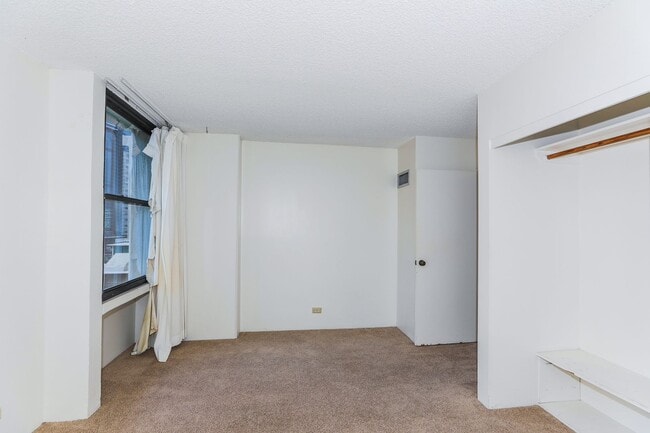Building Photo - Aloha Towers - 2 bedroom, 2 bath corner unit with 1 covered parking stall