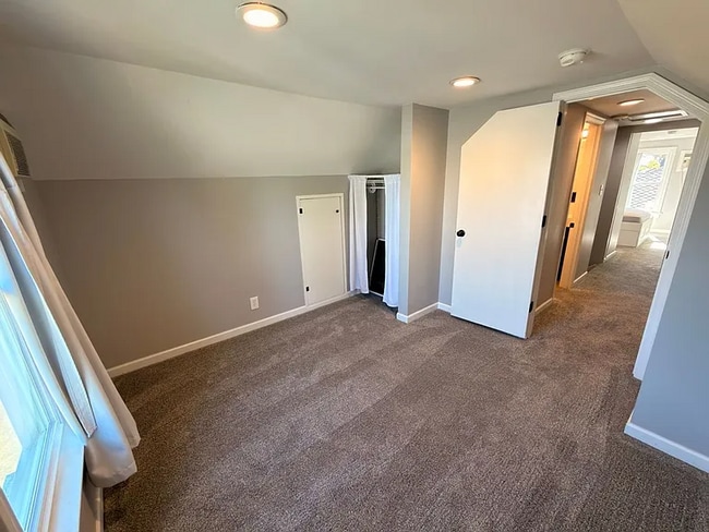 Building Photo - This spacious four-bedroom, two-bathroom