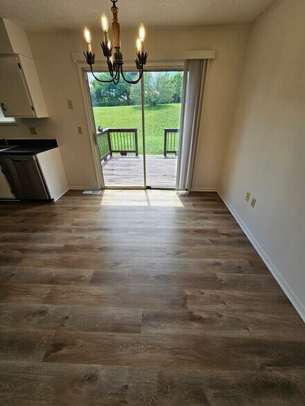 View of patio/walkout deck from dining area. - 265 N Ashbrook Cir